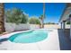 Inviting backyard pool with desert landscaping providing privacy at 9728 Drumcannon Ave, Las Vegas, NV 89129