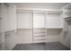 Walk-in closet with custom shelves and hanging rods for optimal organization at 9728 Drumcannon Ave, Las Vegas, NV 89129