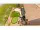 This aerial image shows a home with a putting green and desert landscaping in the backyard at 10348 Hawks Wing St, Las Vegas, NV 89178