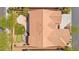 Aerial view showing a well-maintained house with desert landscaping, a backyard putting green and patio at 10348 Hawks Wing St, Las Vegas, NV 89178