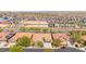 Expansive aerial view shows a vibrant community with modern homes, new construction, and nearby amenities at 10348 Hawks Wing St, Las Vegas, NV 89178