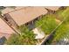An aerial view of the home and backyard featuring a large patio and desert landscaping at 10348 Hawks Wing St, Las Vegas, NV 89178