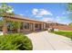A large backyard featuring a patio, hot tub, green spaces and desert landscaping at 10348 Hawks Wing St, Las Vegas, NV 89178