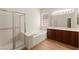 Spacious bathroom with shower, tub, dual sink vanity and natural light at 10348 Hawks Wing St, Las Vegas, NV 89178