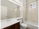 Cozy bathroom features a shower-tub combination, vanity, and large mirror at 10348 Hawks Wing St, Las Vegas, NV 89178