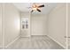 Cozy bedroom features neutral walls, plush carpet, ceiling fan, and shuttered window at 10348 Hawks Wing St, Las Vegas, NV 89178
