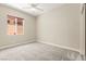 Comfortable bedroom featuring a ceiling fan and large window allowing natural light at 10348 Hawks Wing St, Las Vegas, NV 89178