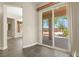 Dining area leading to the backyard with sliding glass doors and neutral color scheme at 10348 Hawks Wing St, Las Vegas, NV 89178