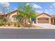 Charming single-story home with a desert landscape, inviting curb appeal, and a two car garage at 10348 Hawks Wing St, Las Vegas, NV 89178
