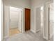 Hallway featuring multiple doorways that lead to various parts of the home at 10348 Hawks Wing St, Las Vegas, NV 89178