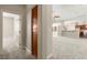 Hallway view leading to an open floor plan with kitchen and adjacent rooms at 10348 Hawks Wing St, Las Vegas, NV 89178