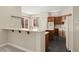Bright kitchen featuring a breakfast bar, ample counter space, and modern appliances at 10348 Hawks Wing St, Las Vegas, NV 89178