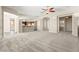 Open-concept living area with plush carpet, seamlessly connects to the kitchen and other living spaces at 10348 Hawks Wing St, Las Vegas, NV 89178