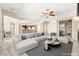 Bright living room featuring an open layout, modern furniture, and stylish decor at 10348 Hawks Wing St, Las Vegas, NV 89178