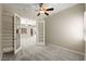Bright home office with built-in bookshelves and glass doors leading to other rooms at 10348 Hawks Wing St, Las Vegas, NV 89178