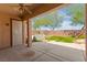 Covered patio with concrete flooring and a view of a hot tub in the backyard at 10348 Hawks Wing St, Las Vegas, NV 89178