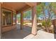 Covered patio with a view of the landscaped backyard featuring a hot tub at 10348 Hawks Wing St, Las Vegas, NV 89178