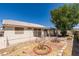 The backyard features desert landscaping, mature trees, brick accents, and a covered patio at 1110 Orchard Valley Dr, Las Vegas, NV 89142