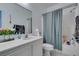 Bathroom featuring shower-tub combo with curtain and a vanity with sink at 1110 Orchard Valley Dr, Las Vegas, NV 89142