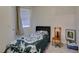 Cozy bedroom with a comfortable bed, chair, carpeted floor, and a window at 1110 Orchard Valley Dr, Las Vegas, NV 89142