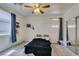 Bedroom with carpeted floors, ceiling fan, and a mirrored closet at 1110 Orchard Valley Dr, Las Vegas, NV 89142
