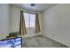 Empty bedroom featuring carpeted floors and a window with blinds at 1110 Orchard Valley Dr, Las Vegas, NV 89142