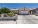 Charming single-story home featuring a well-manicured front yard and attached two-car garage at 1110 Orchard Valley Dr, Las Vegas, NV 89142