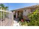 Charming walkway with privacy fence, leading to front door and landscaping at 1110 Orchard Valley Dr, Las Vegas, NV 89142