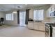 This kitchen has stainless steel appliances, white cabinets and sliding glass door to the patio at 1110 Orchard Valley Dr, Las Vegas, NV 89142