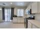 Bright kitchen features stainless steel appliances and white cabinets at 1110 Orchard Valley Dr, Las Vegas, NV 89142