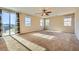 Large bedroom with carpet, many windows, and a ceiling fan at 1178 Yellow Orchid St, Henderson, NV 89002