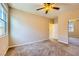 This bedroom features neutral walls, soft carpet, and a ceiling fan, creating a cozy atmosphere at 1178 Yellow Orchid St, Henderson, NV 89002