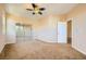 Carpeted bedroom featuring a ceiling fan, recessed lights, and a mirrored closet at 1178 Yellow Orchid St, Henderson, NV 89002