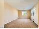 Bright, neutral bedroom with plush carpet, large windows for ample light, and plenty of space at 1178 Yellow Orchid St, Henderson, NV 89002