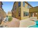 View of the rear of the home, showing the patio, backyard, and stucco exterior at 1178 Yellow Orchid St, Henderson, NV 89002