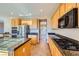 Well-equipped kitchen featuring stainless appliances, granite countertops, and a practical layout for easy cooking at 1178 Yellow Orchid St, Henderson, NV 89002