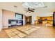 Open-concept living room featuring a fireplace and tile flooring at 1178 Yellow Orchid St, Henderson, NV 89002