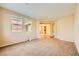 Spacious living room features neutral walls and plush carpet, creating a cozy and inviting atmosphere at 1178 Yellow Orchid St, Henderson, NV 89002