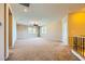 Spacious loft area with neutral walls, carpet, and lots of natural light beaming from large windows at 1178 Yellow Orchid St, Henderson, NV 89002