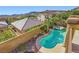 A gorgeous turquoise pool and spa are nestled behind a charming stucco home at 1178 Yellow Orchid St, Henderson, NV 89002