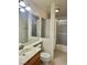 Bathroom featuring a wide mirror, vanity, toilet, and a walk-in shower at 1461 Harmony Hill Dr, Henderson, NV 89014