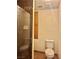 Cozy bathroom featuring a glass shower enclosure, toilet, and storage at 1461 Harmony Hill Dr, Henderson, NV 89014