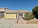 Charming single-story home featuring a tile roof and a well-manicured front yard at 1461 Harmony Hill Dr, Henderson, NV 89014