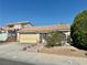 A cozy single-story home featuring desert landscaping and a tile roof at 1461 Harmony Hill Dr, Henderson, NV 89014