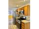 Modern kitchen featuring stainless steel appliances, tile countertops, and ample cabinet storage at 1461 Harmony Hill Dr, Henderson, NV 89014