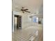 Bright living room with tile flooring, ceiling fan, and natural light from windows at 1461 Harmony Hill Dr, Henderson, NV 89014
