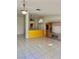 Open floor plan with tile floors, ceiling fan, and views to the kitchen at 1461 Harmony Hill Dr, Henderson, NV 89014