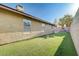 Low-maintenance backyard featuring artificial turf and desert landscaping at 1708 Anzio St, Las Vegas, NV 89108