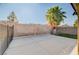 Low-maintenance backyard featuring a concrete patio and a palm tree at 1708 Anzio St, Las Vegas, NV 89108
