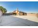 Large backyard featuring a covered patio with solar panels and a concrete area at 1708 Anzio St, Las Vegas, NV 89108